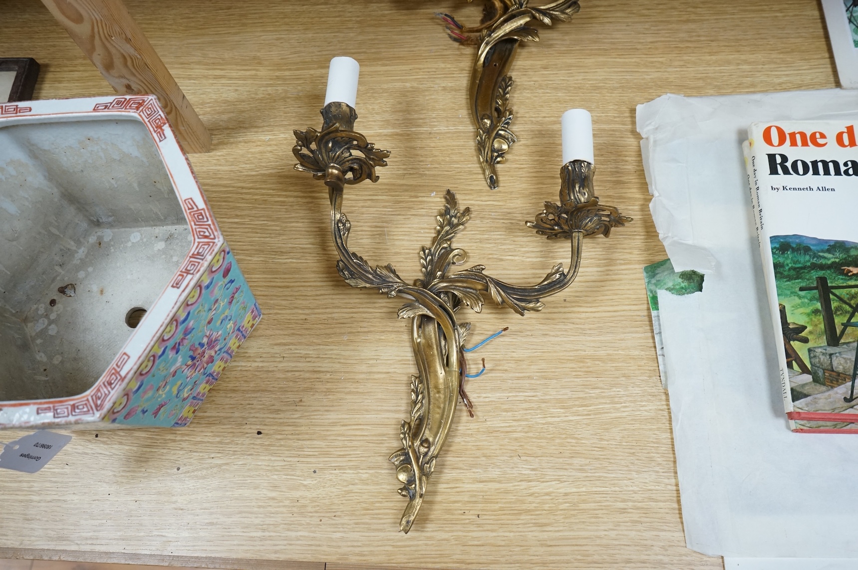 A pair of gilt metal two branch wall sconces, 37cm